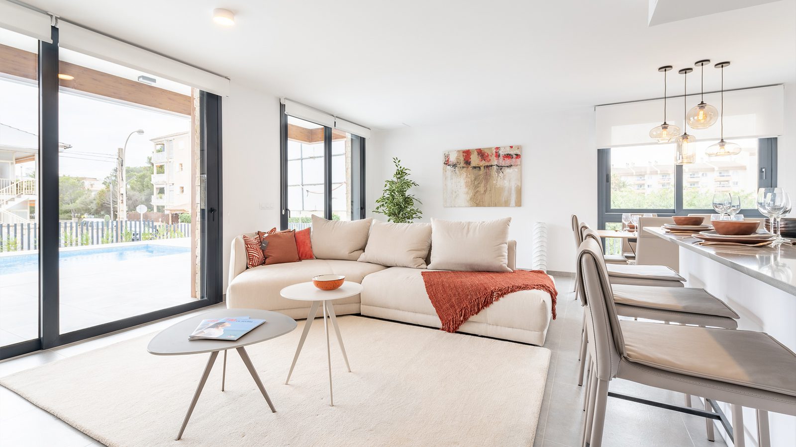 Stylish living room and dining area with pool access in a 3-bedroom semi-detached in Capdepera - The Estates