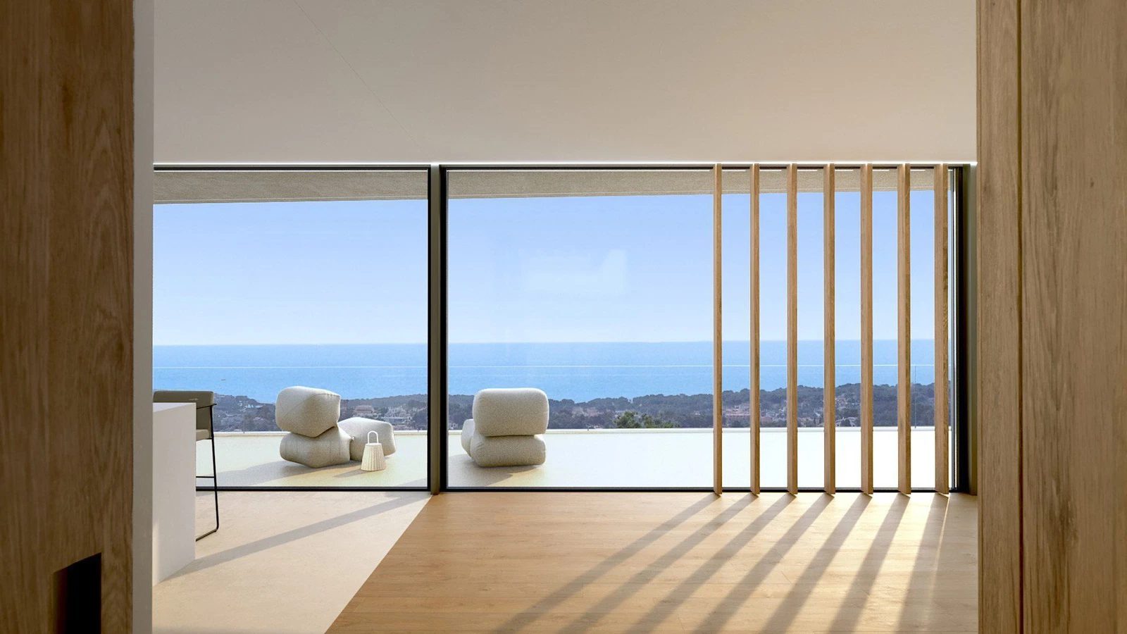 Panoramic sea views from a modern living space in a 4-bedroom villa in Moraira - The Estates