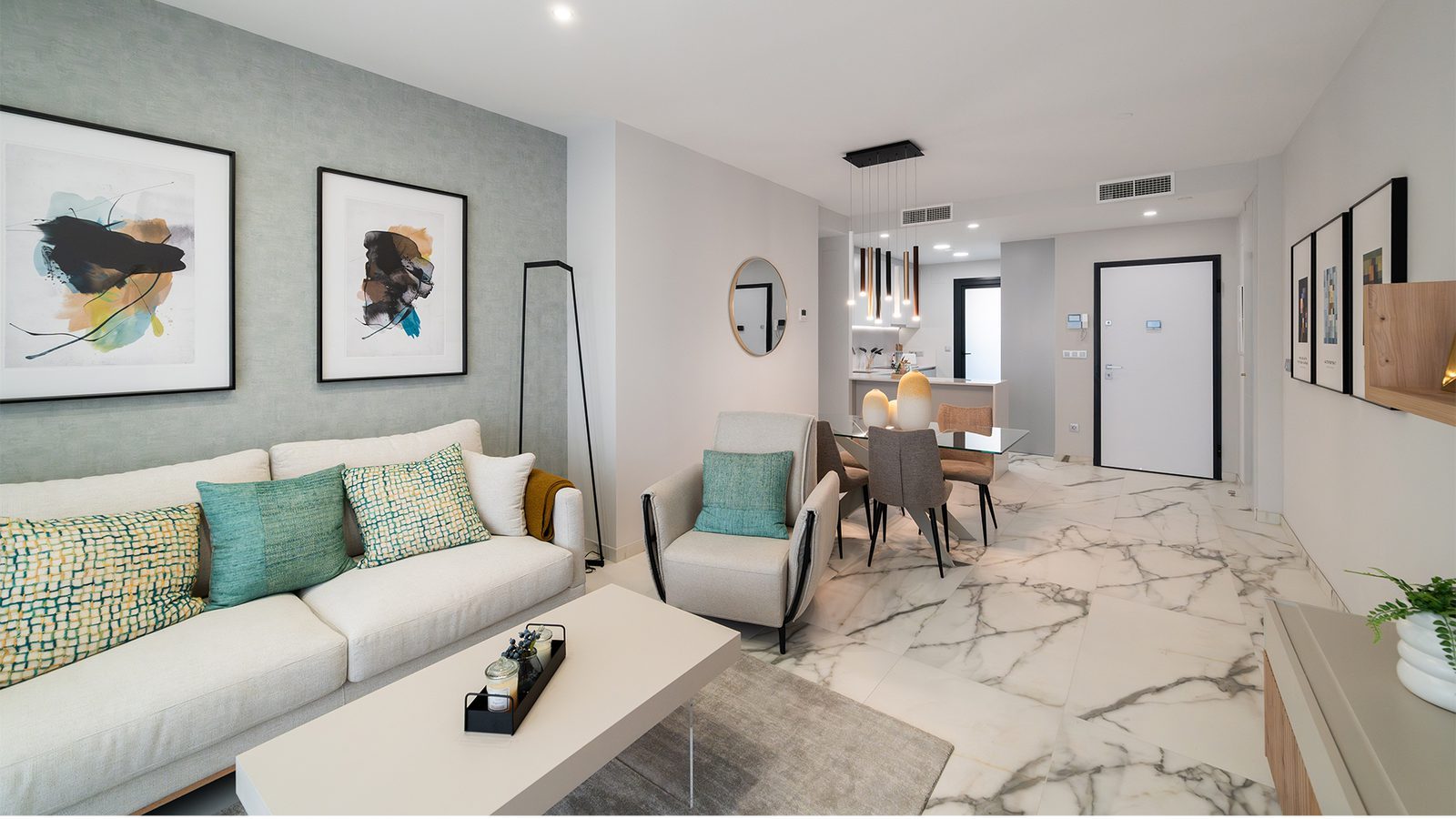 Open-plan living and dining room with sofa, armchair, modern decor and marble-effect flooring in a 3-bedroom apartment in Benidorm - The Estates