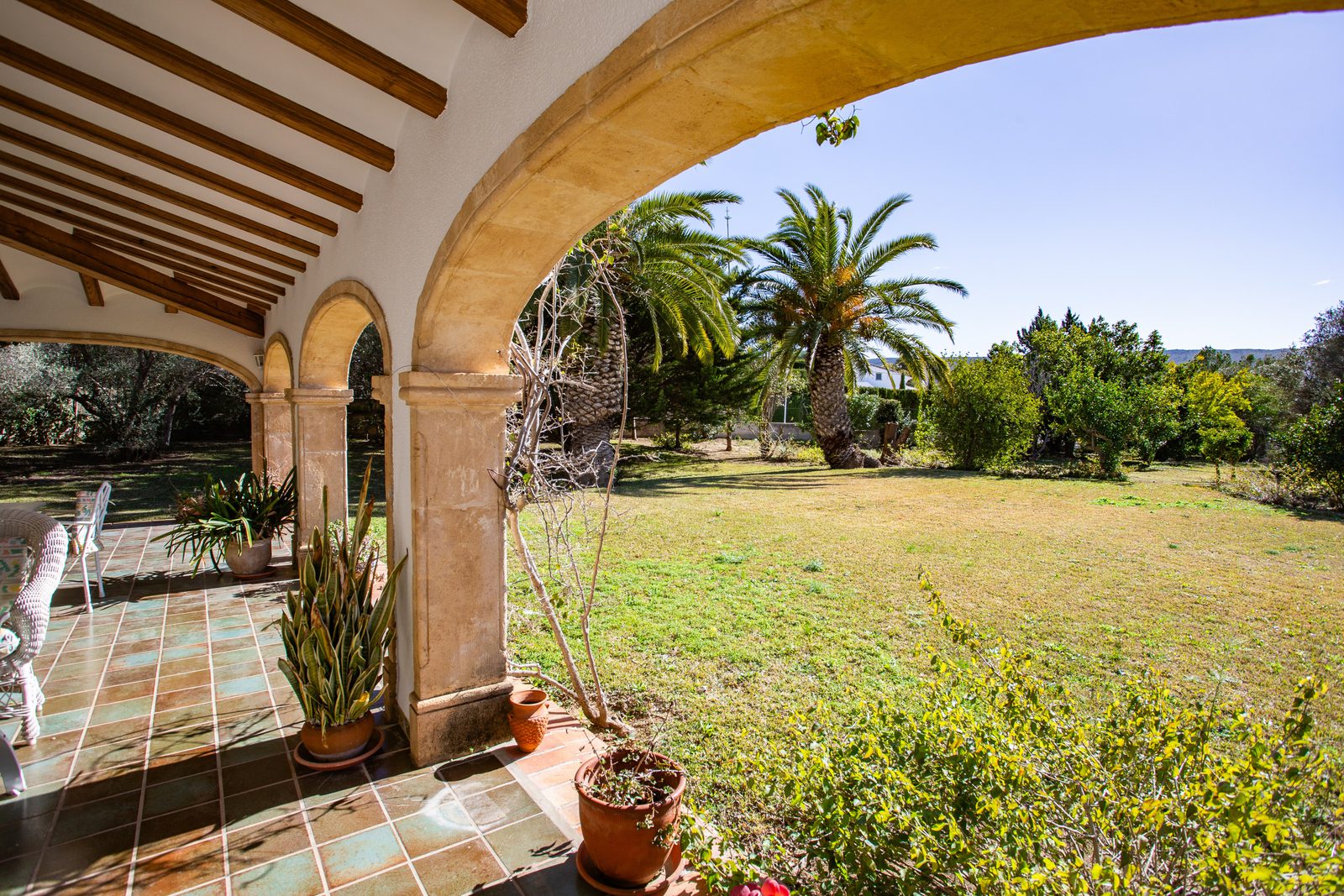Covered terrace with garden and countryside views of a 4-bedroom villa in Javea - The Estates