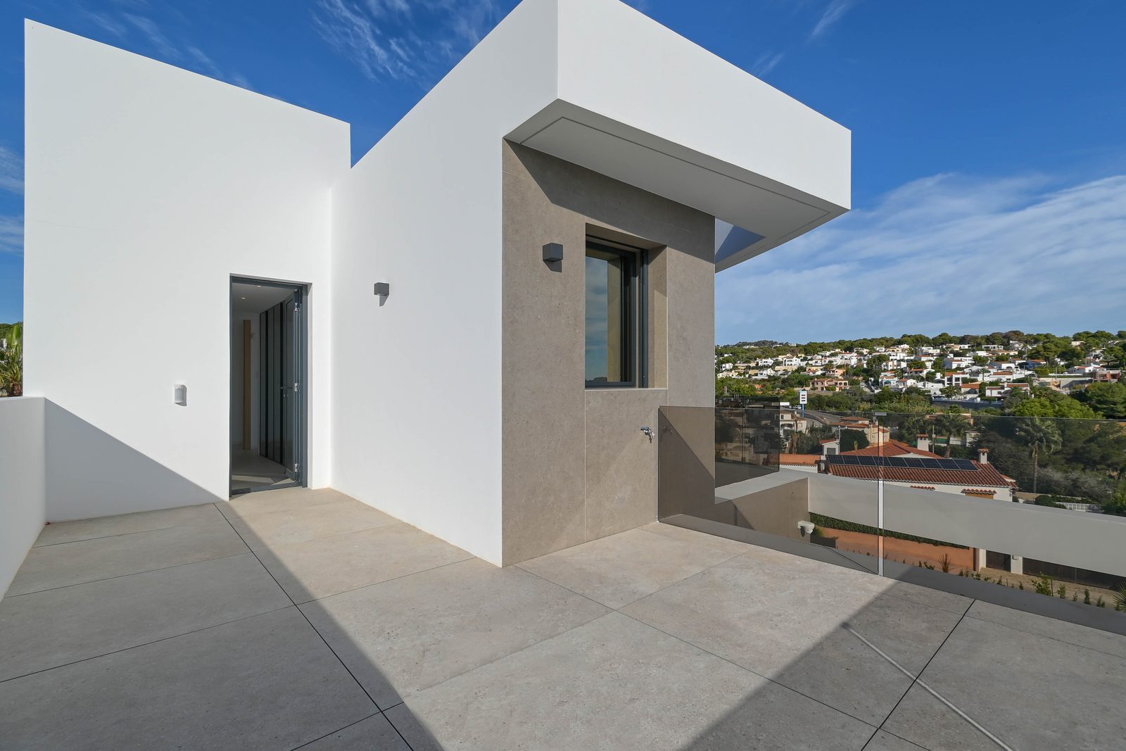 Modern terrace overlooking the surrounding neighbourhood of a 4-bedroom villa in Benissa - The Estates