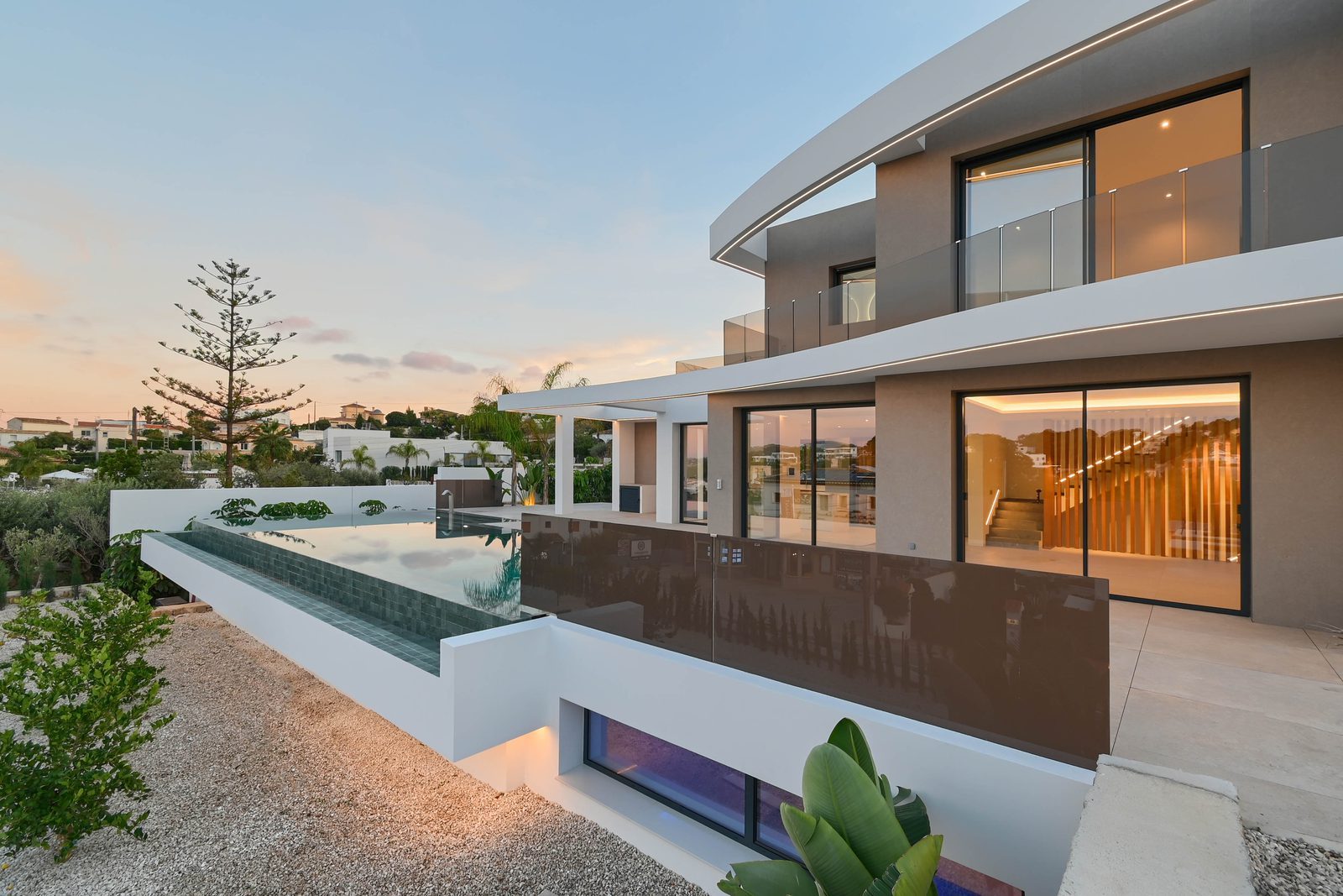Modern villa exterior with infinity pool, glass balconies and sea views in La Fustera, Benissa, of a 4-bedroom villa in Benissa - The Estates