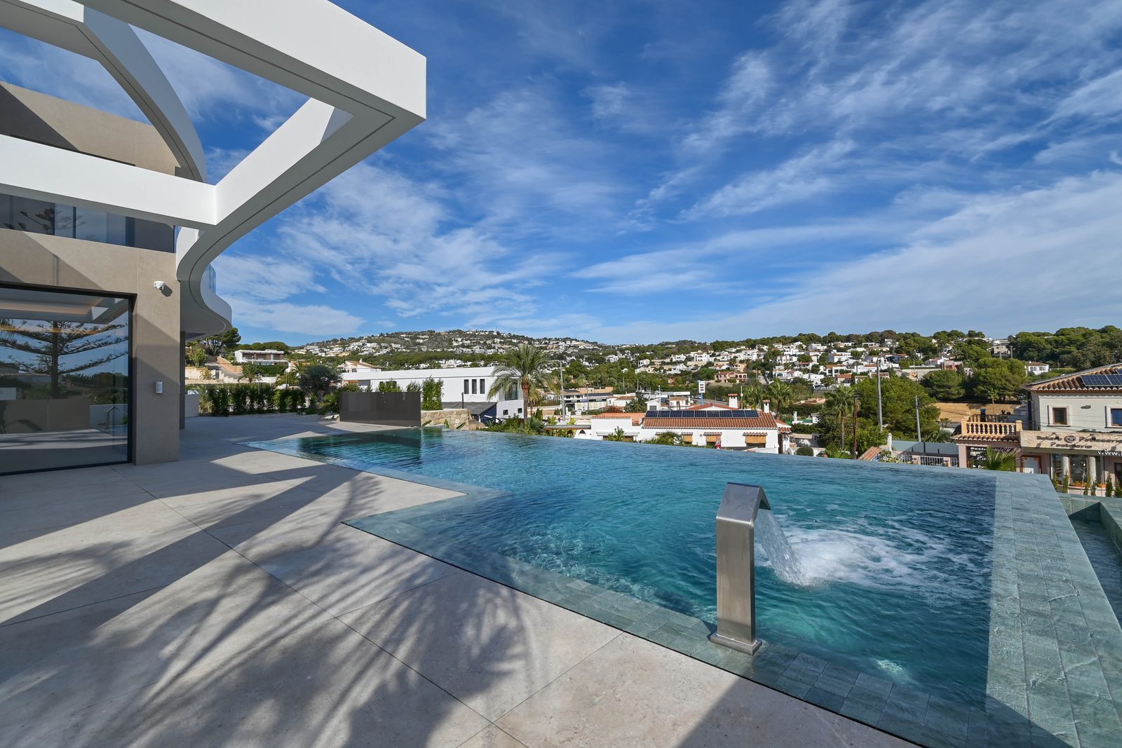 Infinity pool and terrace overlooking the hills