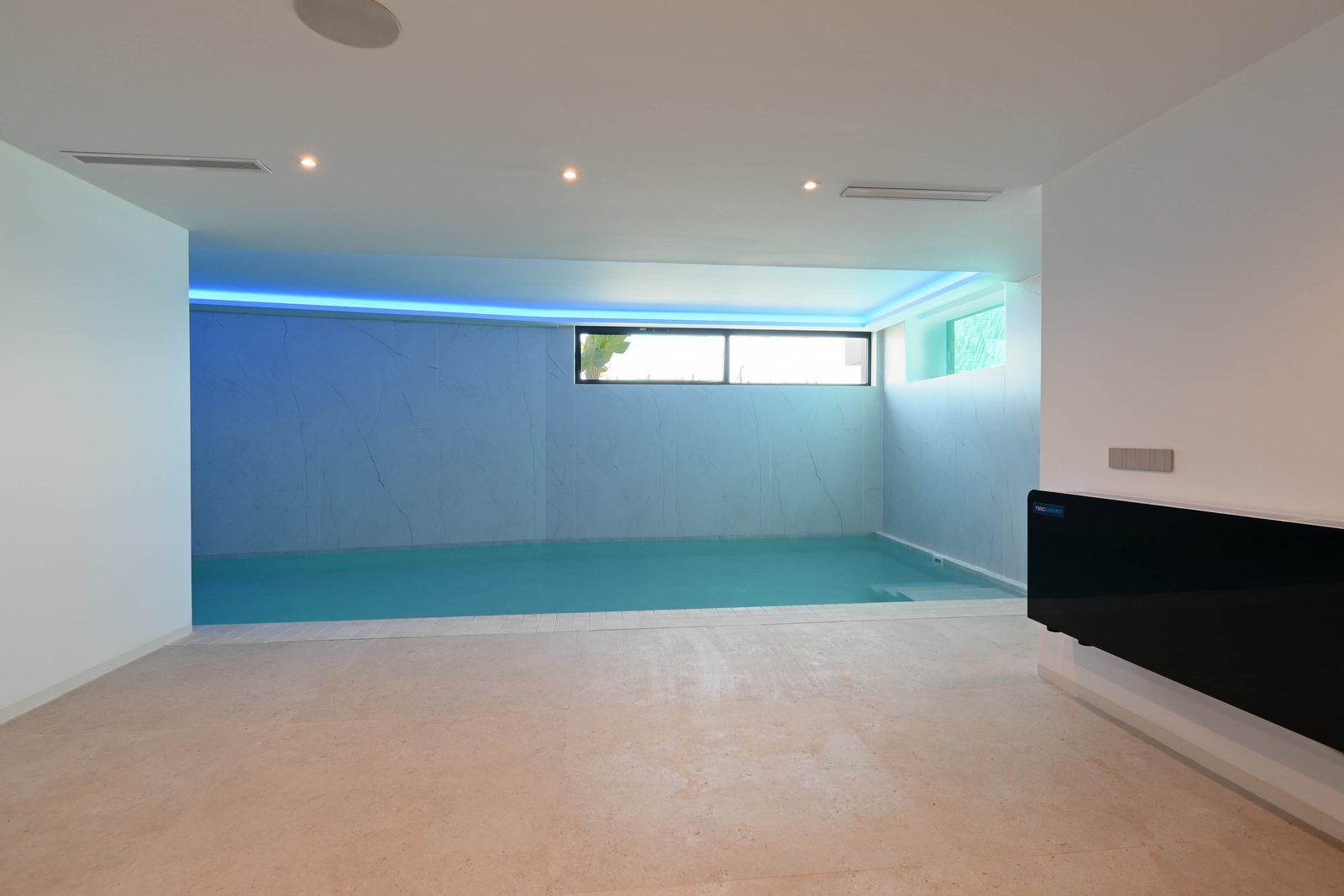 Indoor swimming pool and billiards area of a 4-bedroom villa in Benissa - The Estates