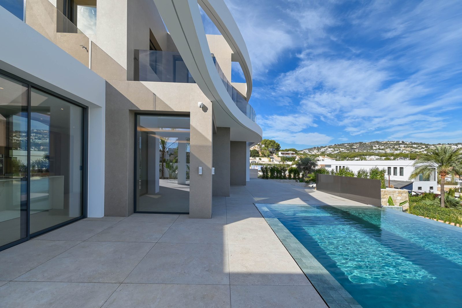 Modern villa exterior with infinity pool and sea views of a 4-bedroom villa in Benissa - The Estates