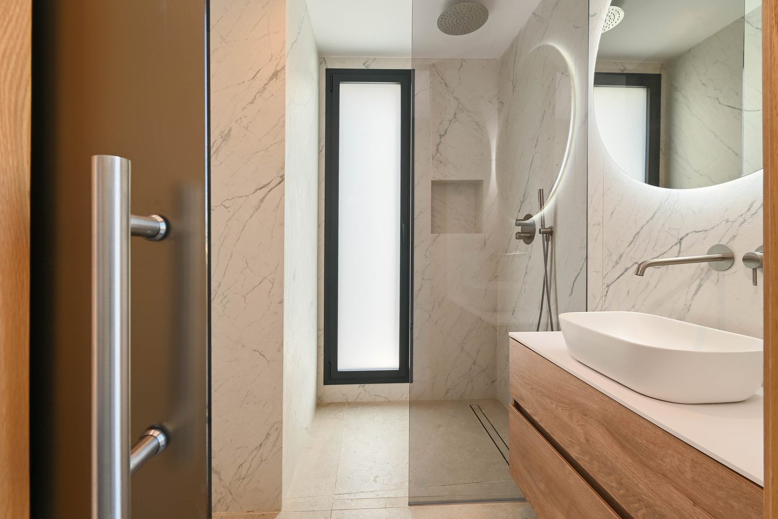 Modern marble bathroom with walk-in shower and vessel sink of a 4-bedroom villa in Benissa - The Estates