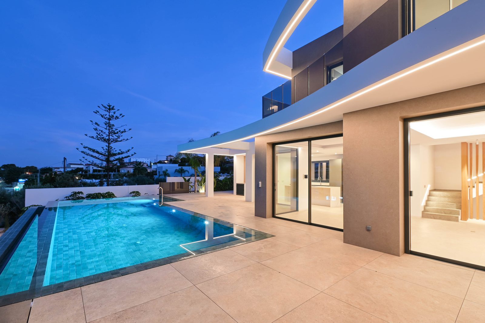 Illuminated pool terrace and modern exterior at