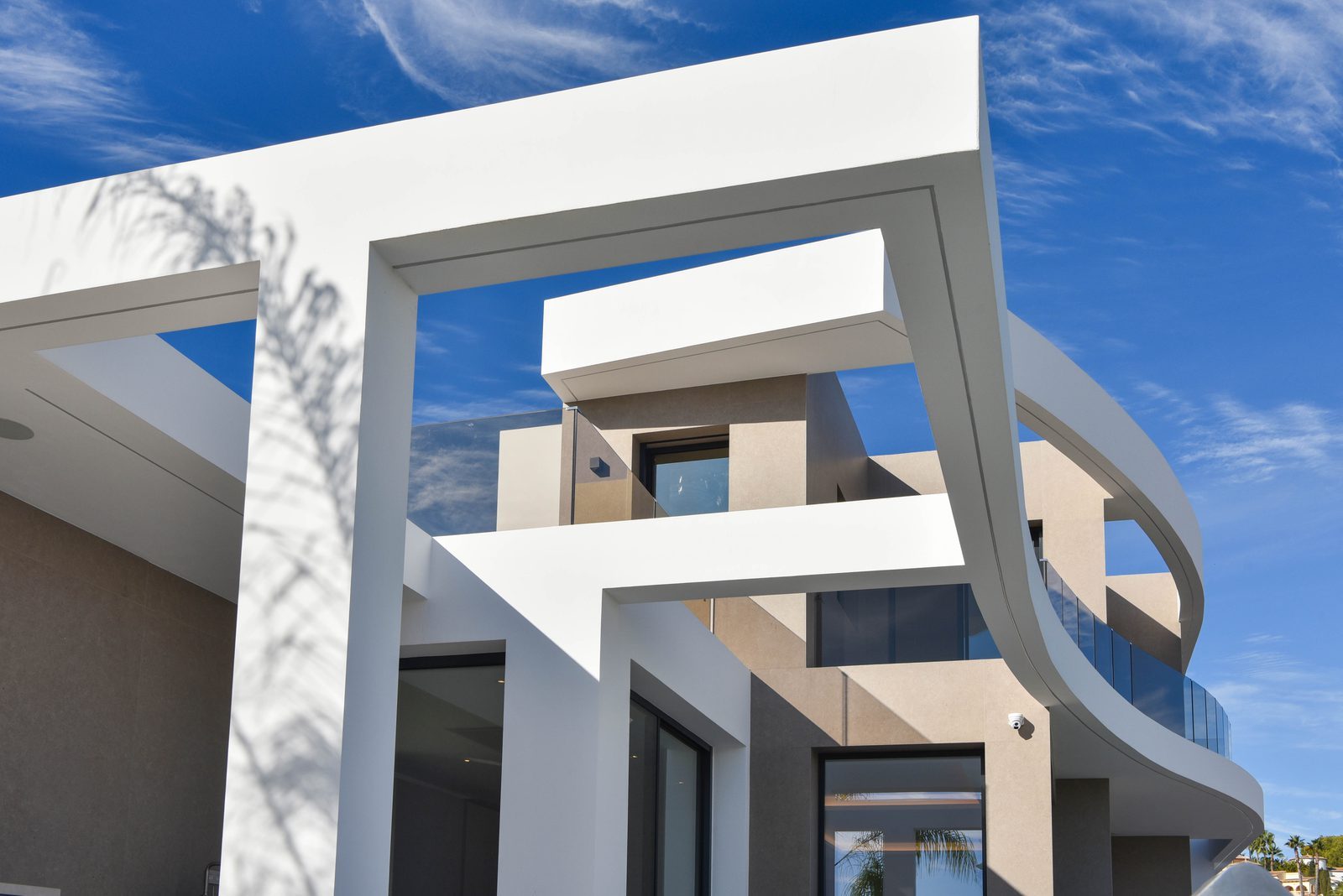 Modern white and beige exterior facade of a 4-bedroom villa in Benissa - The Estates