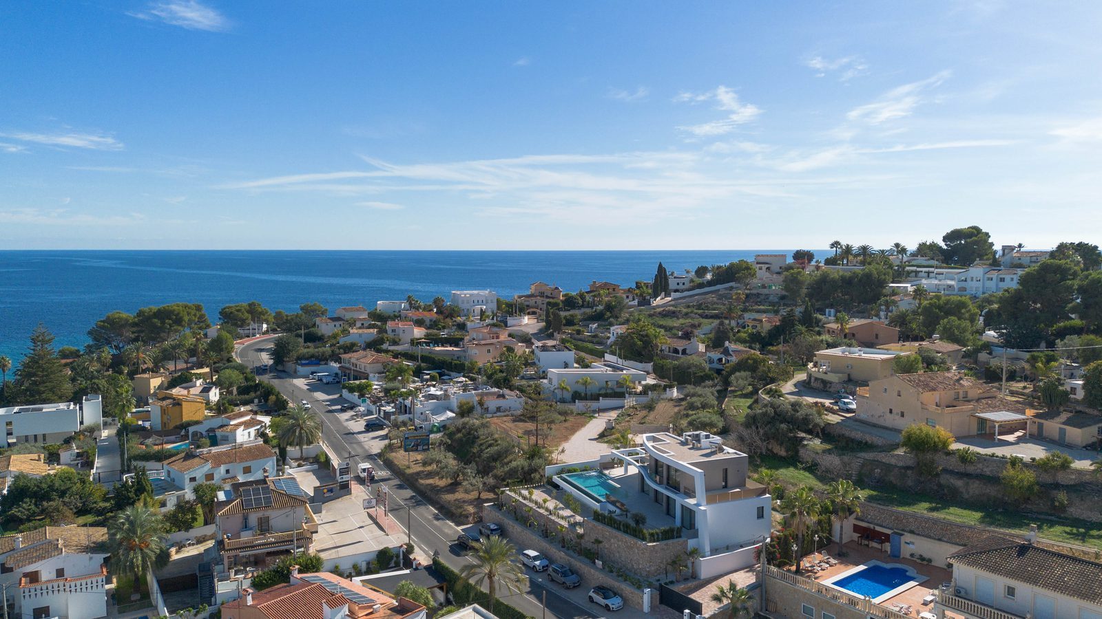 Aerial sea view over La Fustera, Benissa, with coastal villas and Mediterranean homes of a 4-bedroom villa in Benissa - The Estates