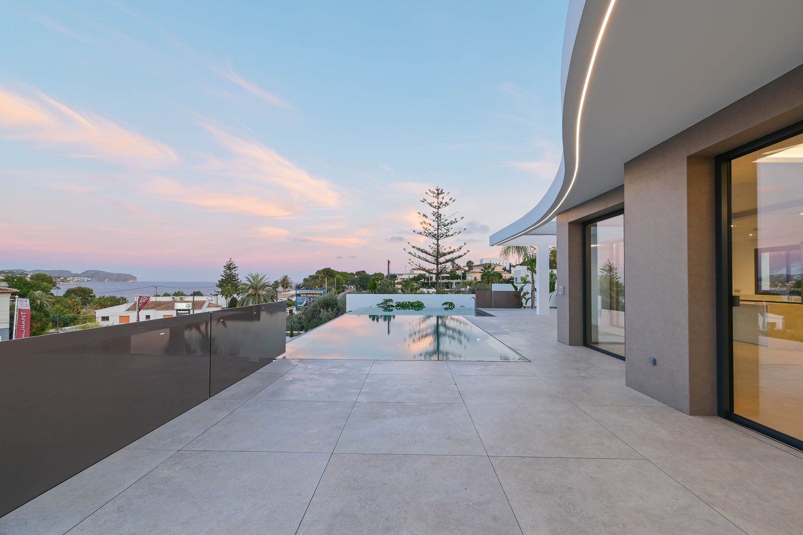 Infinity pool and spacious terrace with sea views at a 4-bedroom villa in Benissa - The Estates