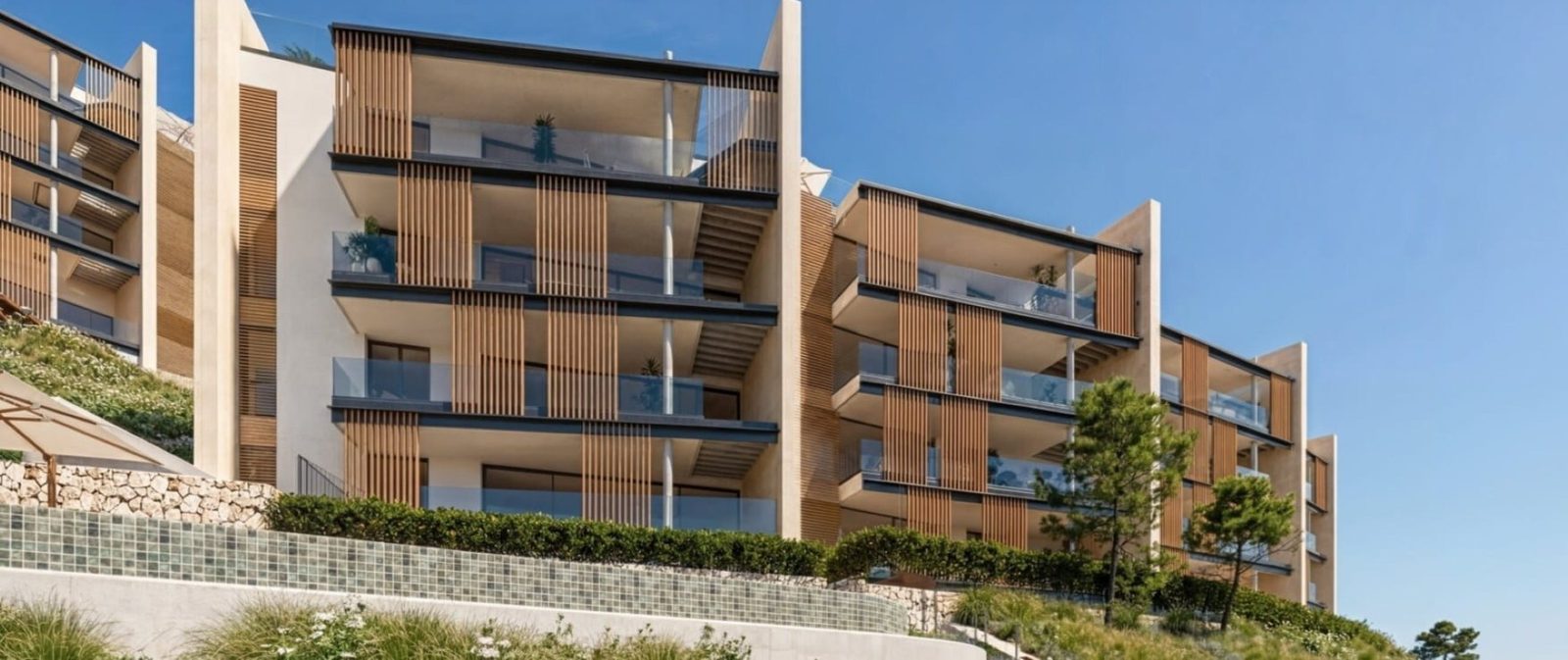 Modern apartment building with balconies, wood screens and landscaped terraces in Calvia - The Estates