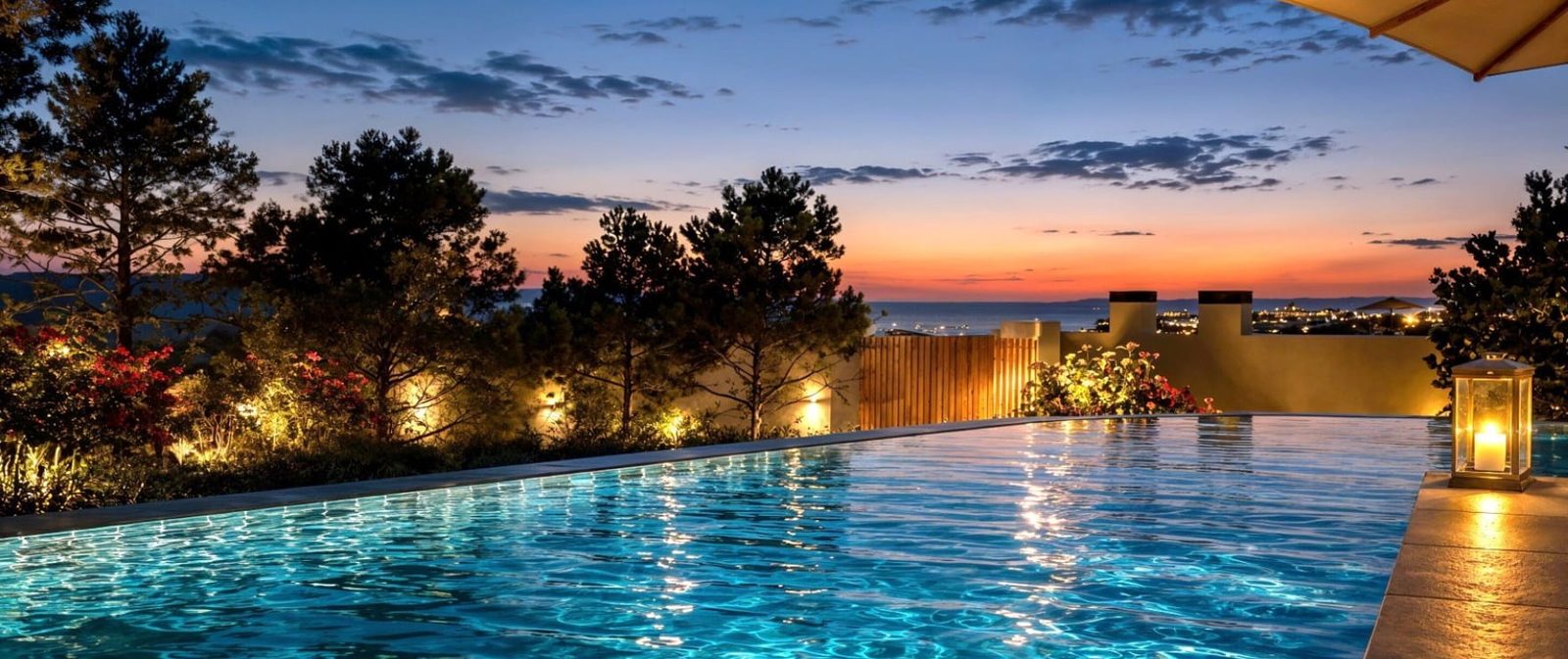 Sunset sea views from an infinity pool of a 2-bedroom apartment