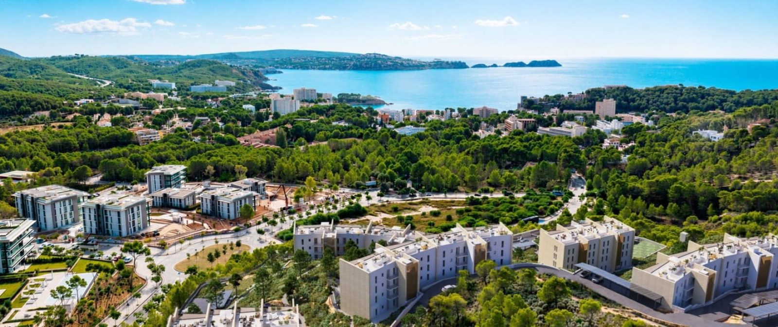 Aerial view of coastal resort, pine forests and turquoise bay in Calvia from a 2-bedroom apartment in Calvia - The Estates