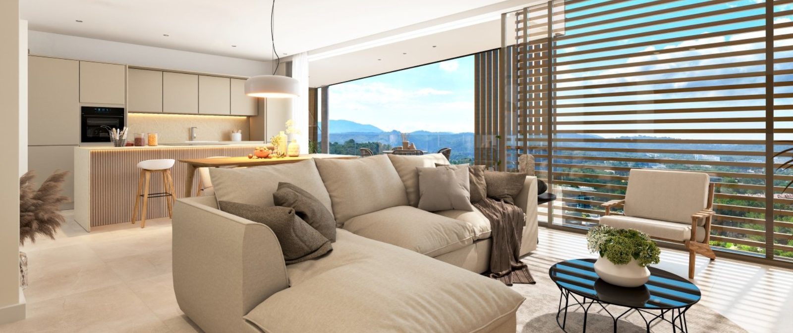 Open-plan living room and kitchen with mountain views, sofa, coffee table and dining island in a 2-bedroom apartment in Calvia - The Estates