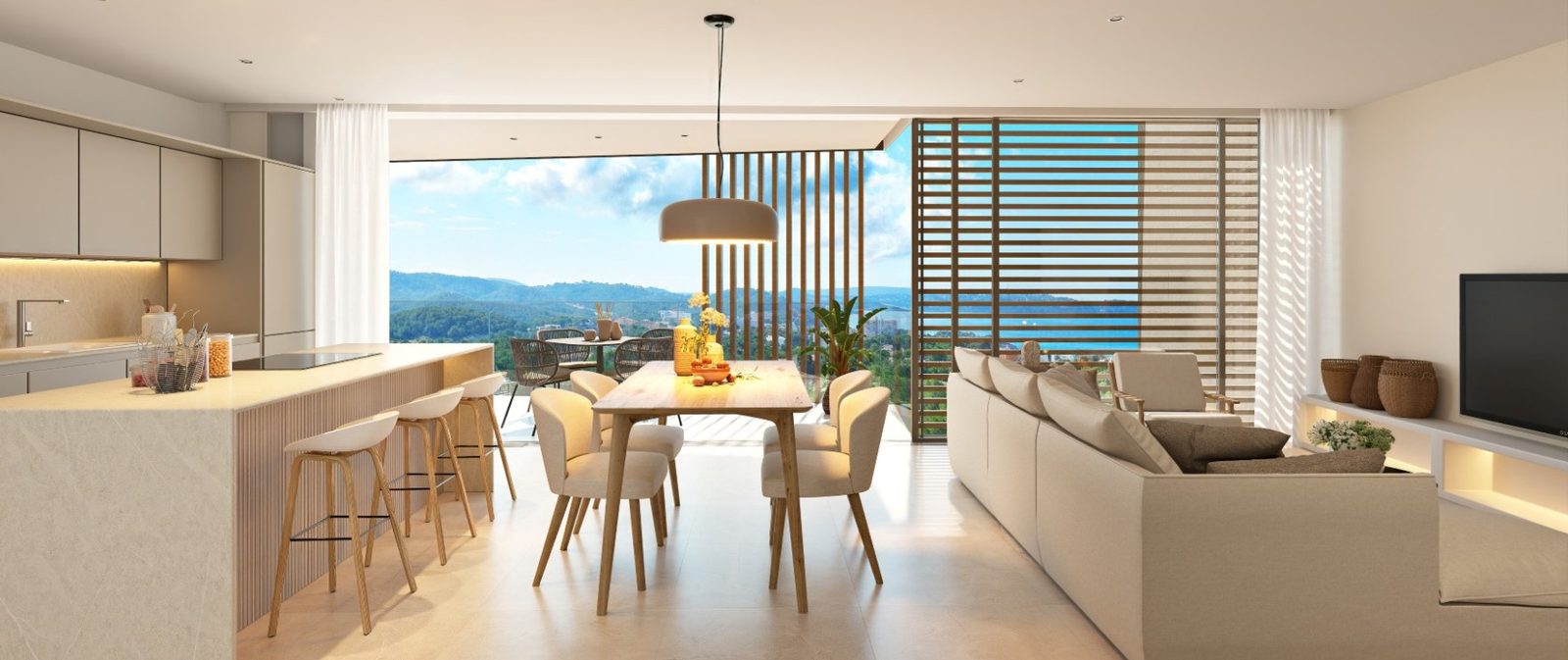 Open-plan kitchen, dining and living area with mountain views in a 2-bedroom apartment in Calvia - The Estates