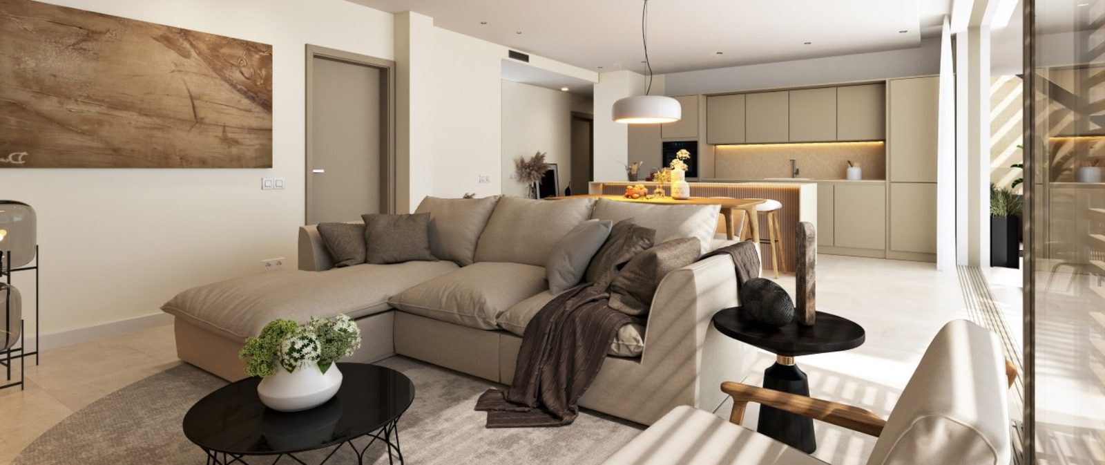 Open-plan living room and kitchen with sectional sofa, dining island and floor-to-ceiling windows of a 2-bedroom apartment in Calvia - The Estates