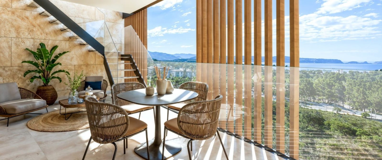 Open-plan dining and living area with staircase and panoramic sea views in a 2-bedroom apartment in Calvia - The Estates