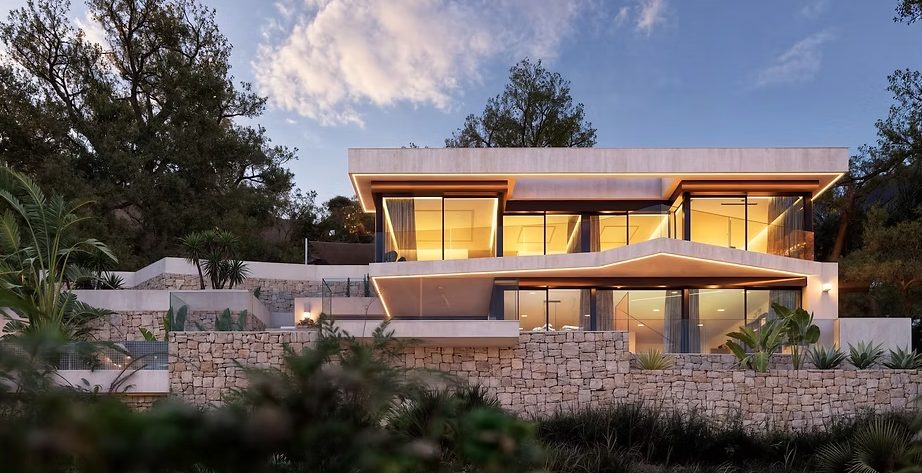 Modern villa exterior with illuminated terraces and stone landscaping in Racó de Galeno, Benissa - The Estates