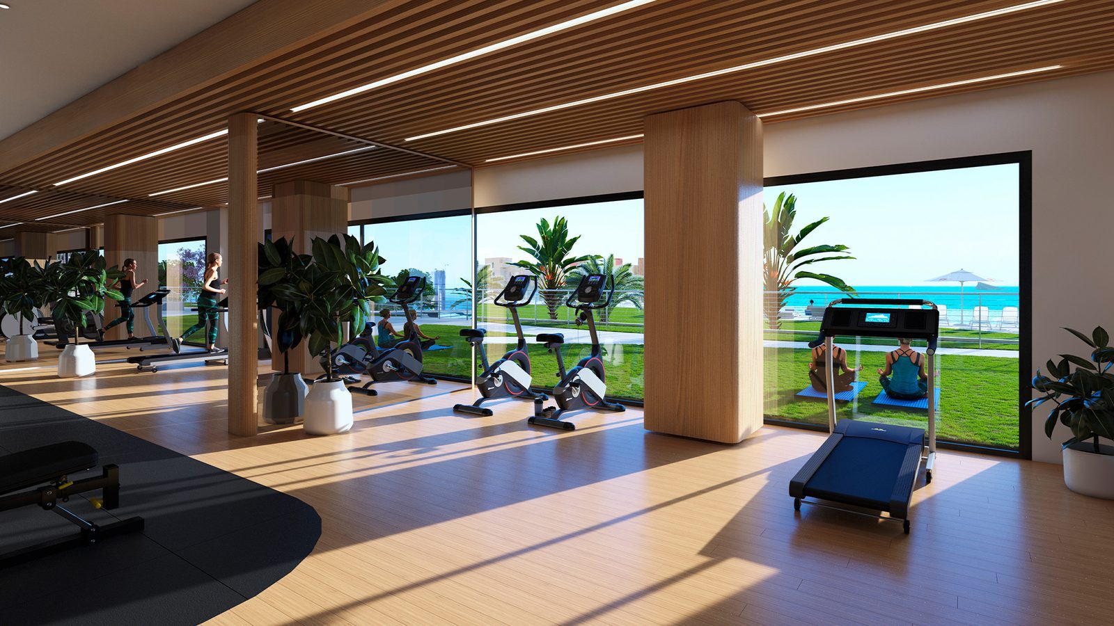 Sea-view gym with treadmills, bikes and exercise equipment in a 3-bedroom apartment in Benidorm - The Estates