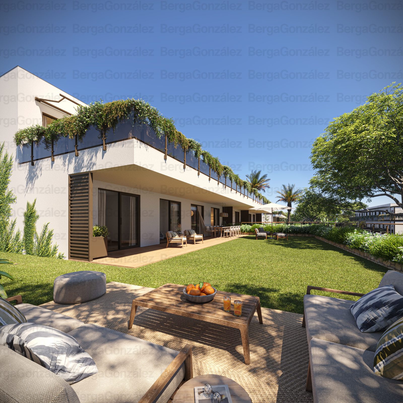 Landscaped garden terrace with outdoor seating and a modern apartment building of a 3-bedroom apartment in Alfaz del Pi - The Estates