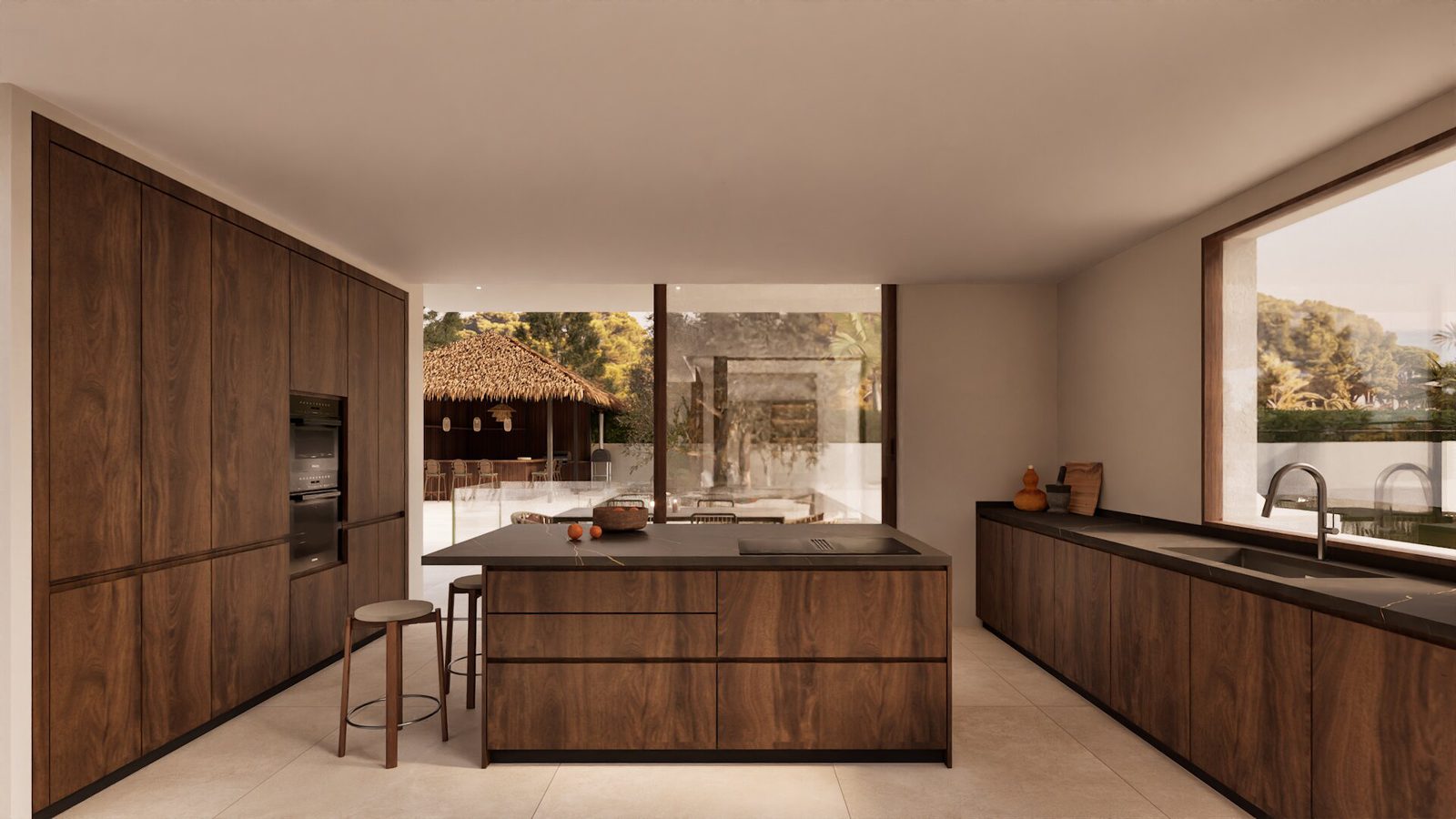 Modern kitchen with island and mountain views inside a 3-bedroom villa in Denia - The Estates