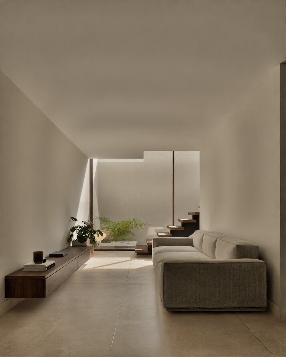 A bright living room with a sofa and plants in a 3-bedroom villa in Denia - The Estates