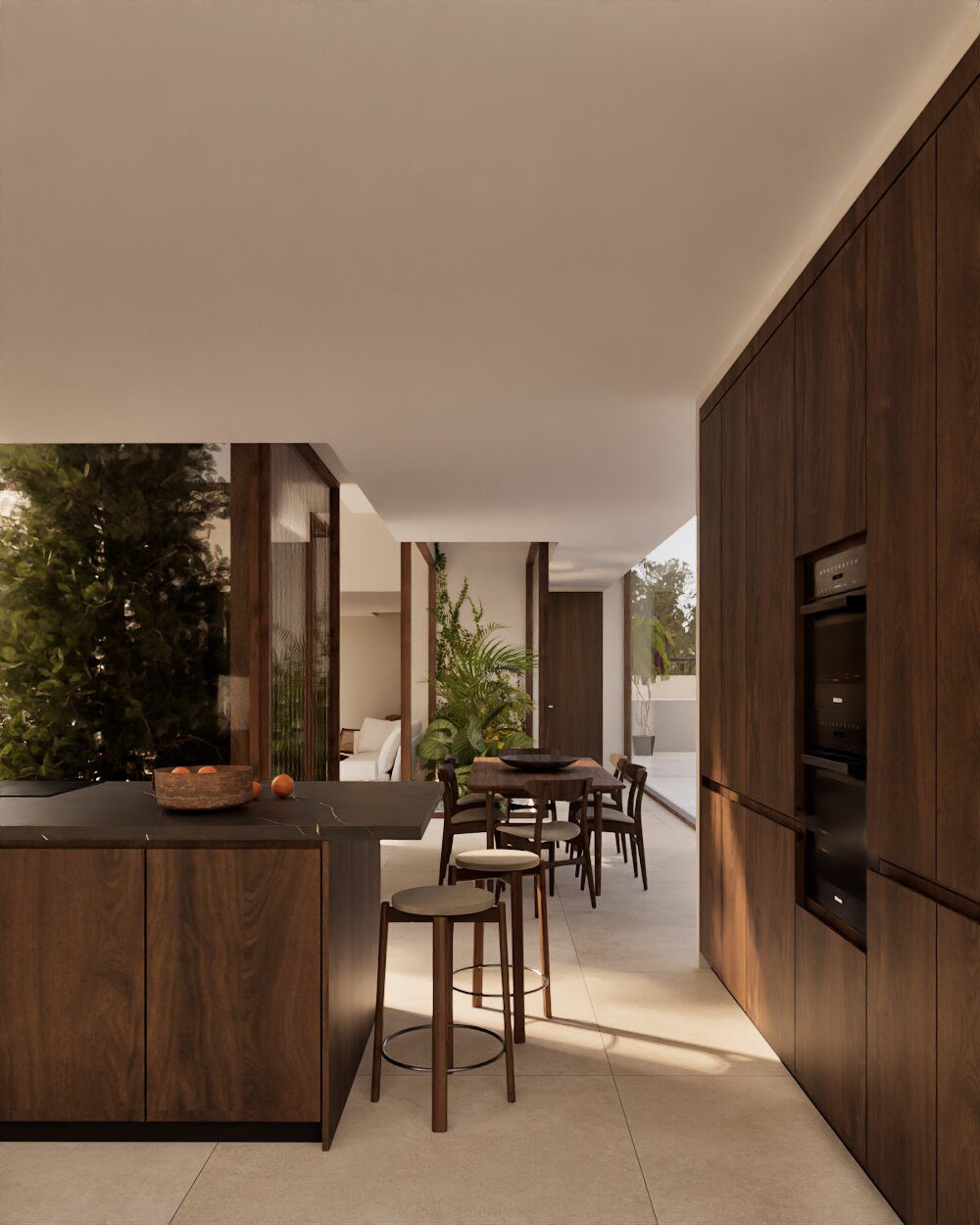 Modern kitchen with island and dining area overlooking a garden in a 3-bedroom villa in Denia - The Estates