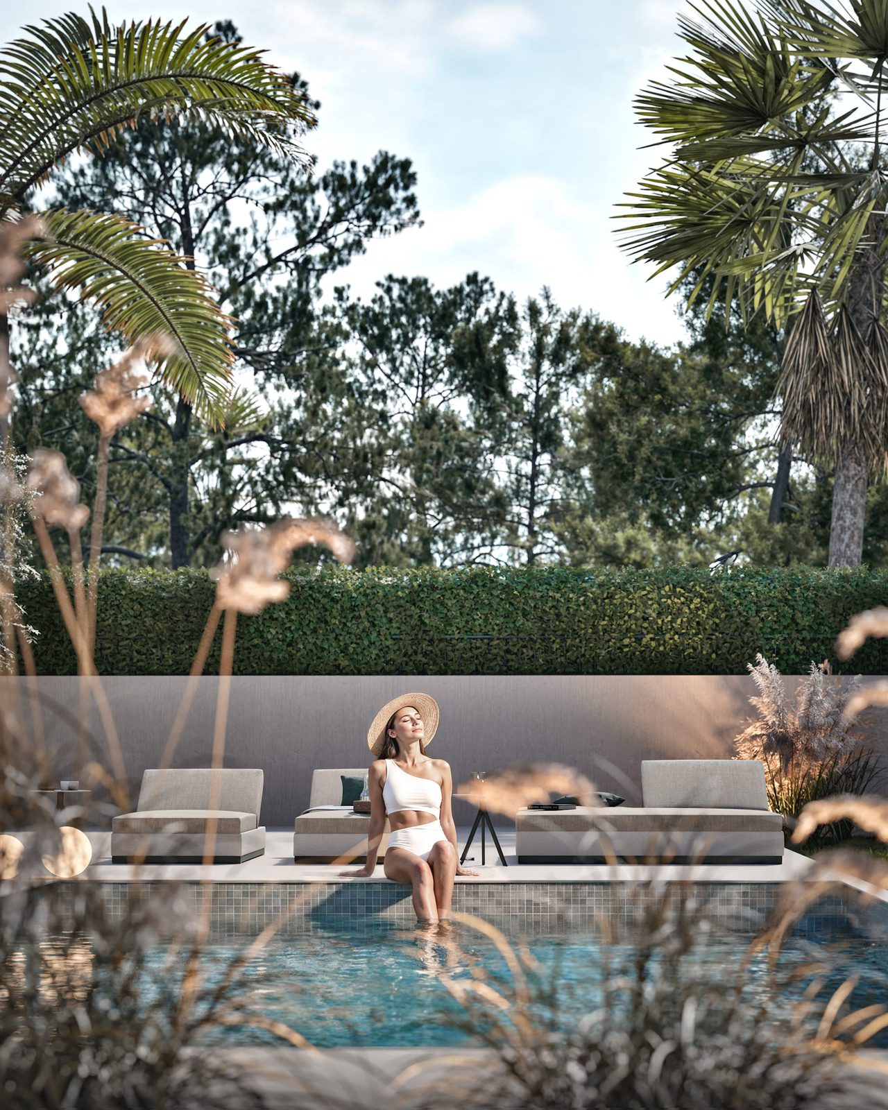 Relaxing poolside with palm trees and greenery at a 3-bedroom villa in Denia - The Estates