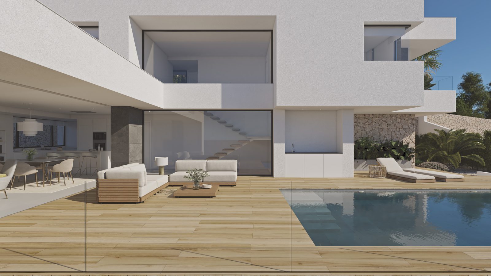 Pool terrace and open-plan living area of a 3-bedroom villa in Benitachell