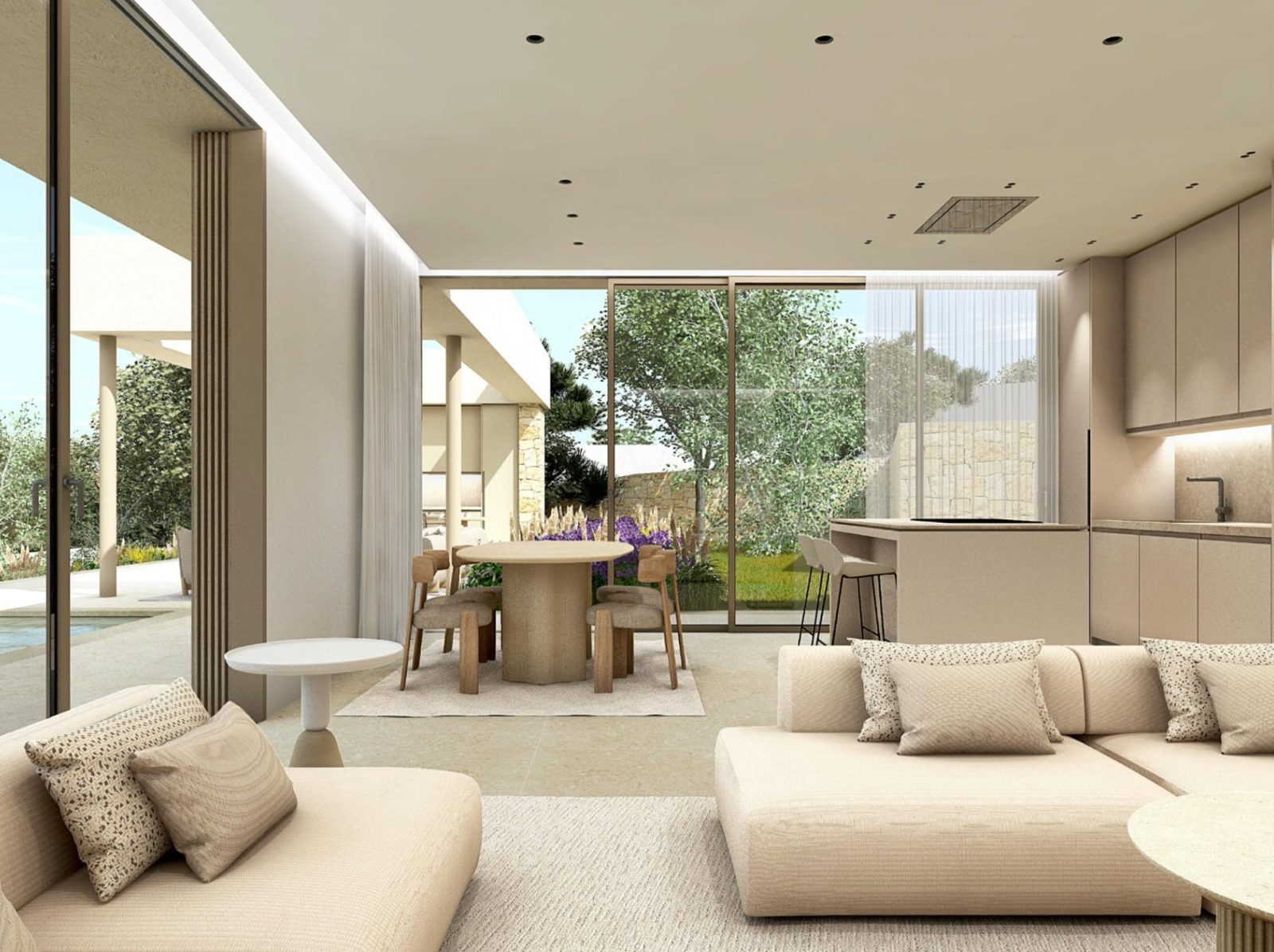 Bright living area with modern kitchen and garden views of a 3-bedroom villa in Dénia - The Estates
