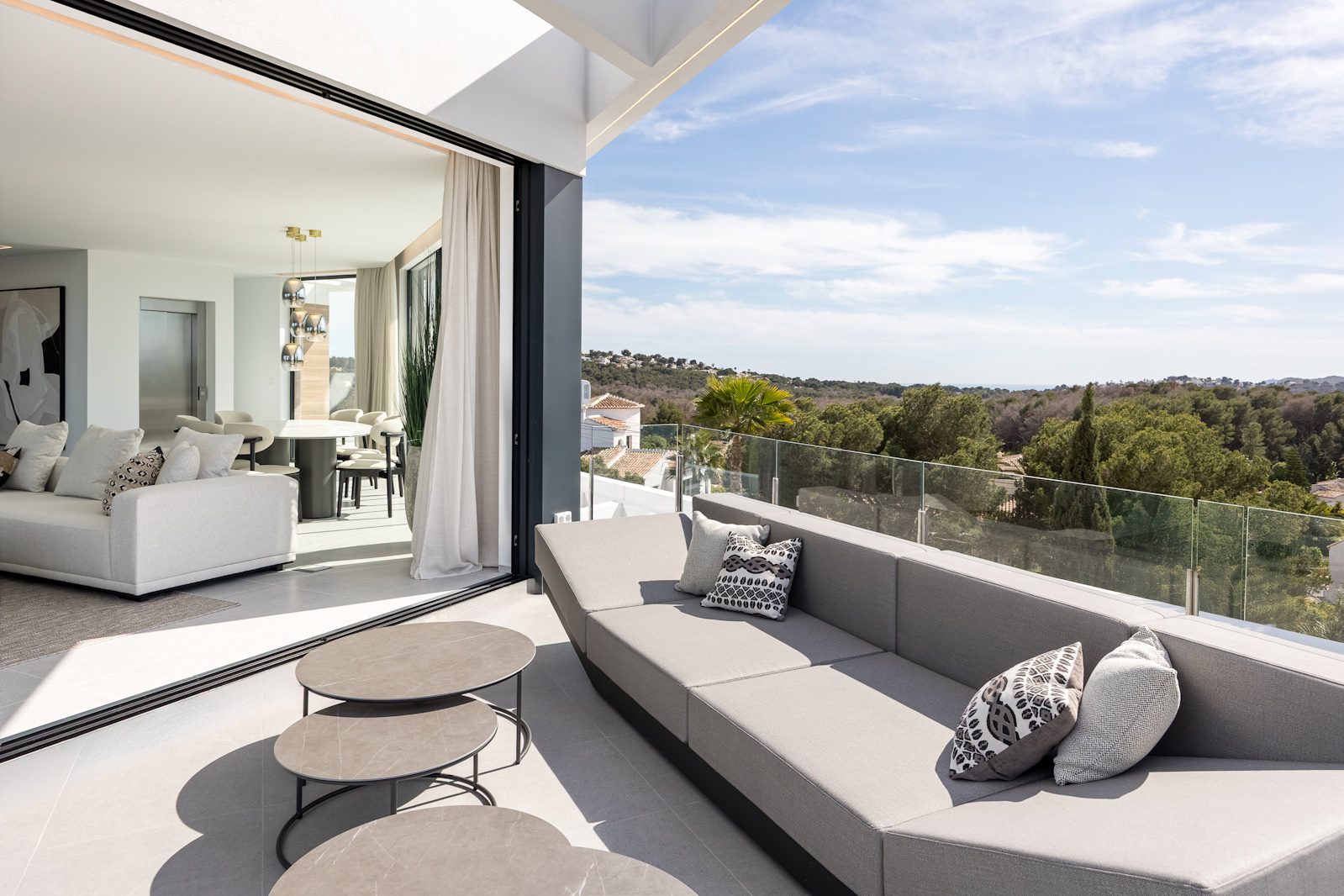 Stylish living room and terrace with panoramic sea views of a 5-bedroom villa in Portixol - The Estates