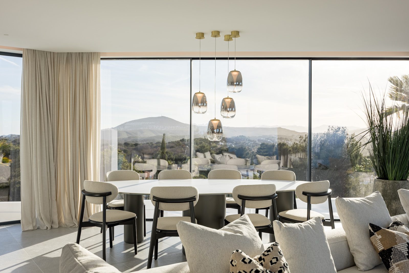 Elegant dining area with panoramic sea views inside a 5-bedroom villa in Portixol - The Estates