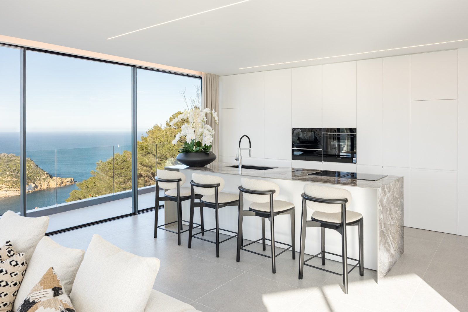 Modern kitchen with stunning sea views inside a 5-bedroom villa in Portixol - The Estates