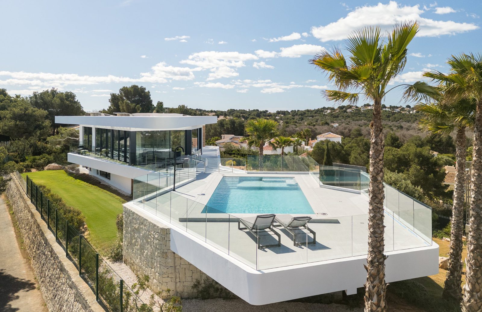 A modern villa with a pool and panoramic sea views in Portixol - The Estates