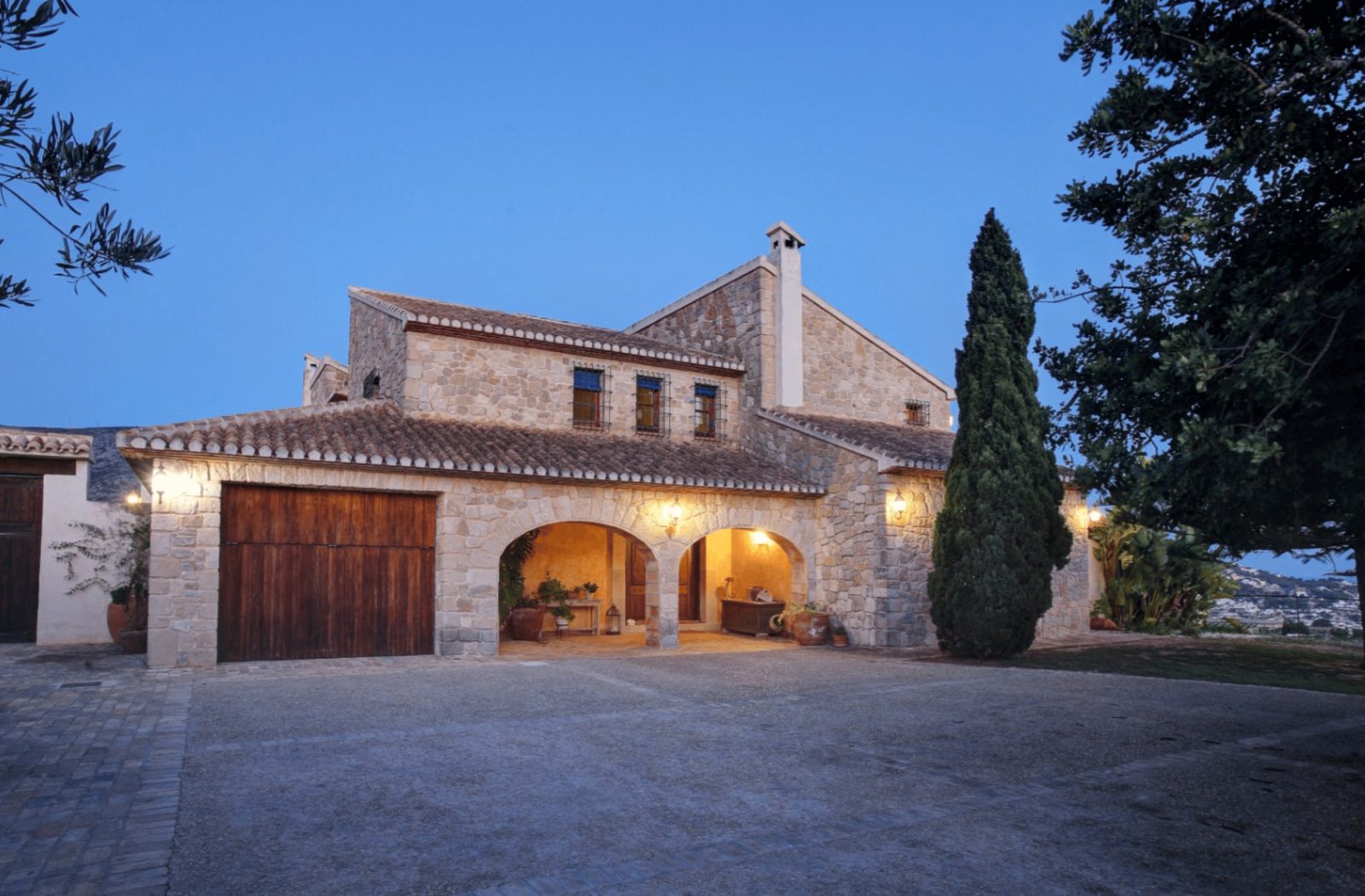 Exterior view of a traditional stone finca in Moraira, with beautiful sea and countryside views - The Estates