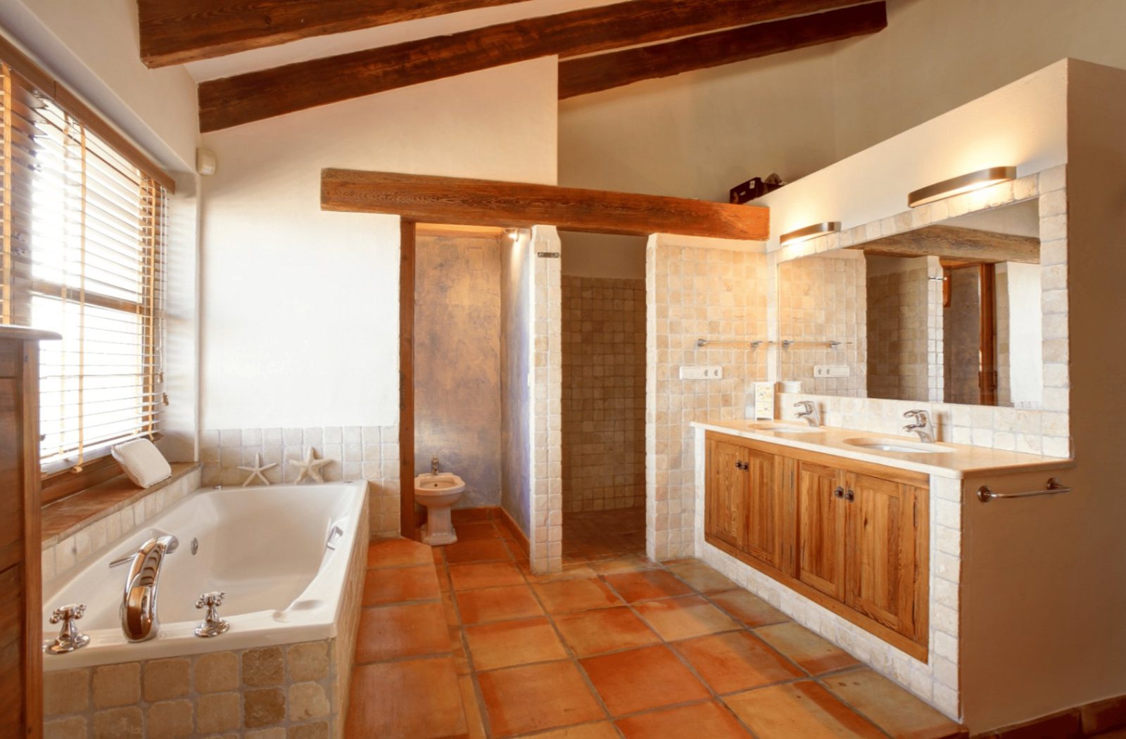 Stylish bathroom with exposed beams and tiled details in a 4-bedroom finca in Moraira - The Estates