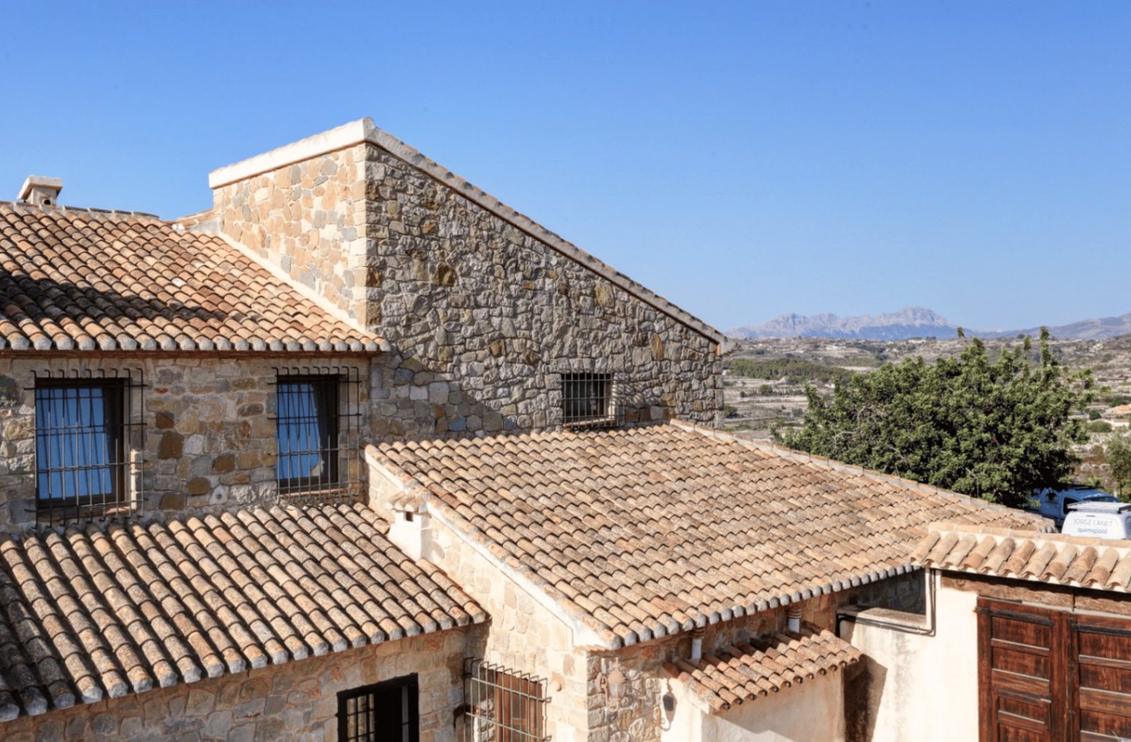 Stunning roof detail and mountain views of a 4-bedroom finca in Moraira - The Estates