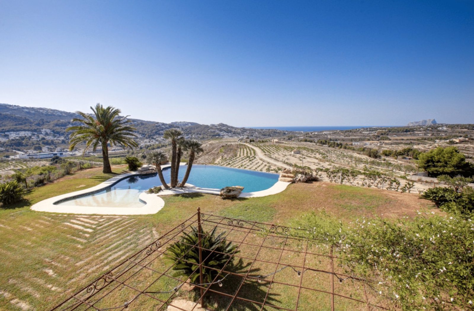 Stunning sea and countryside views from the pool area of a 4-bedroom finca in Moraira - The Estates