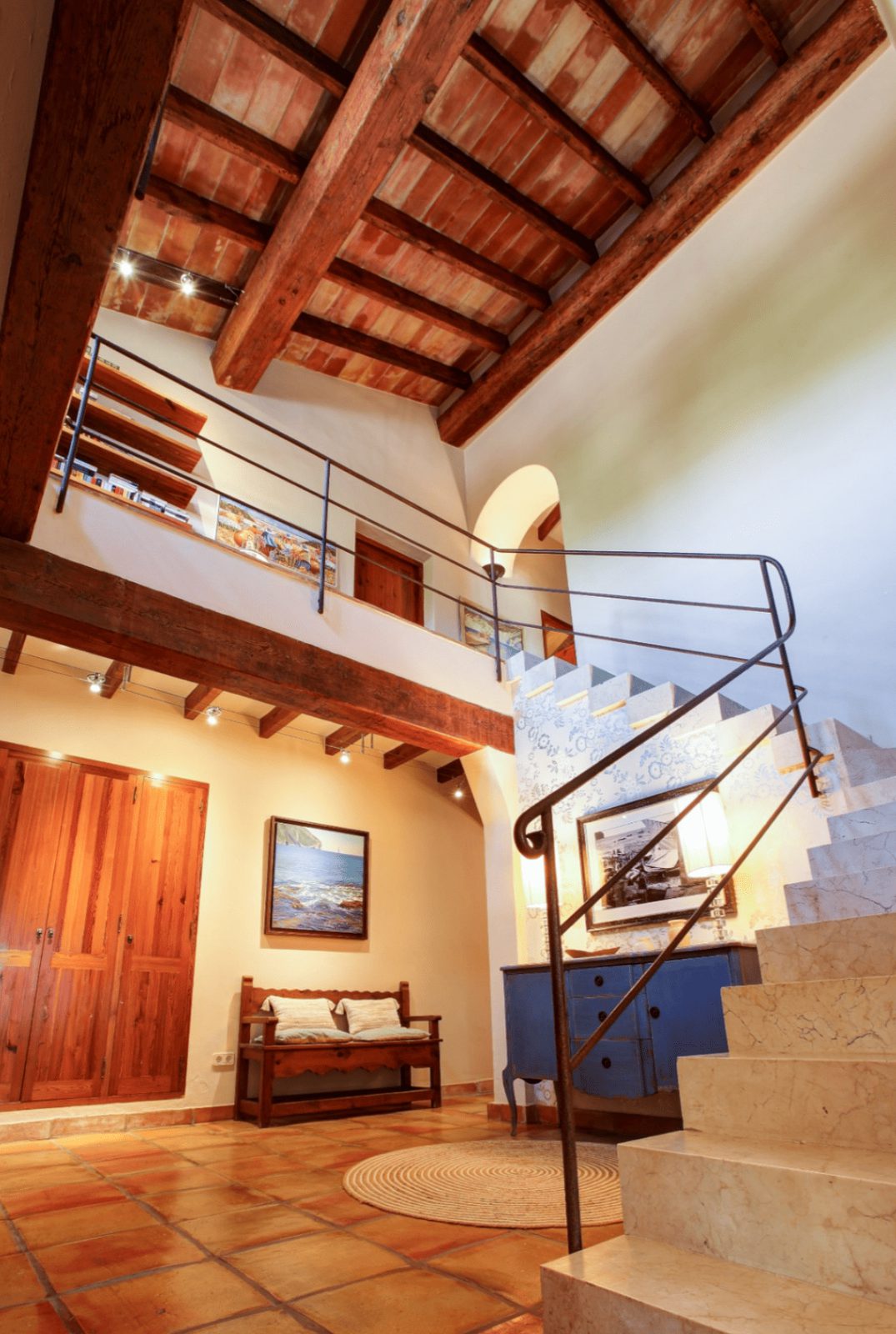 Beautiful interior with exposed wooden beams and a staircase in a 4-bedroom finca in Moraira - The Estates