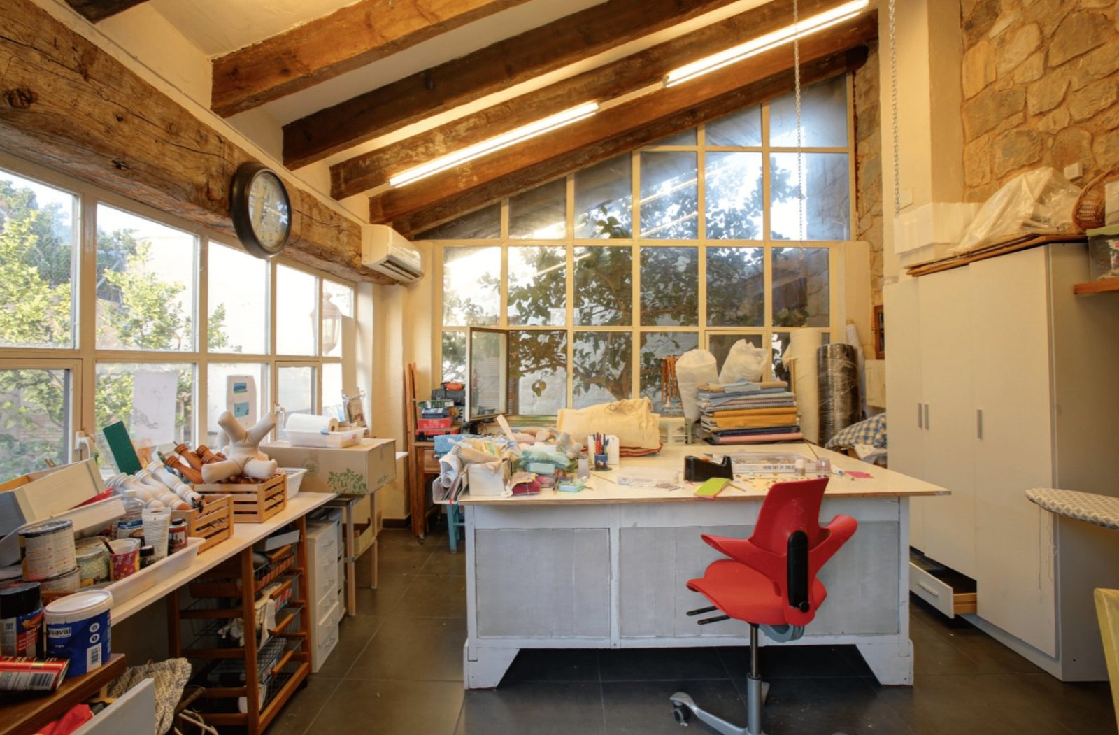 Bright, rustic interior with exposed beams and large windows in a 4-bedroom finca in Moraira - The Estates