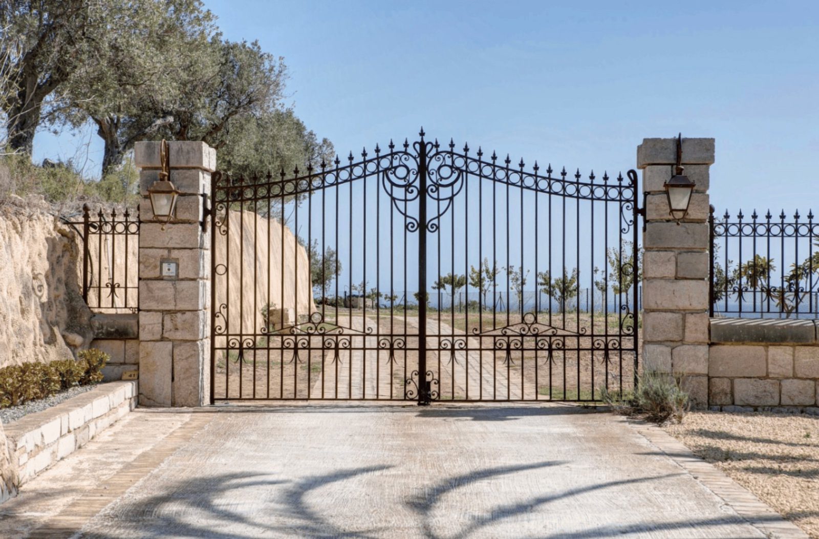 An ornate wrought iron gate leading to a 4-bedroom finca in Moraira - The Estates