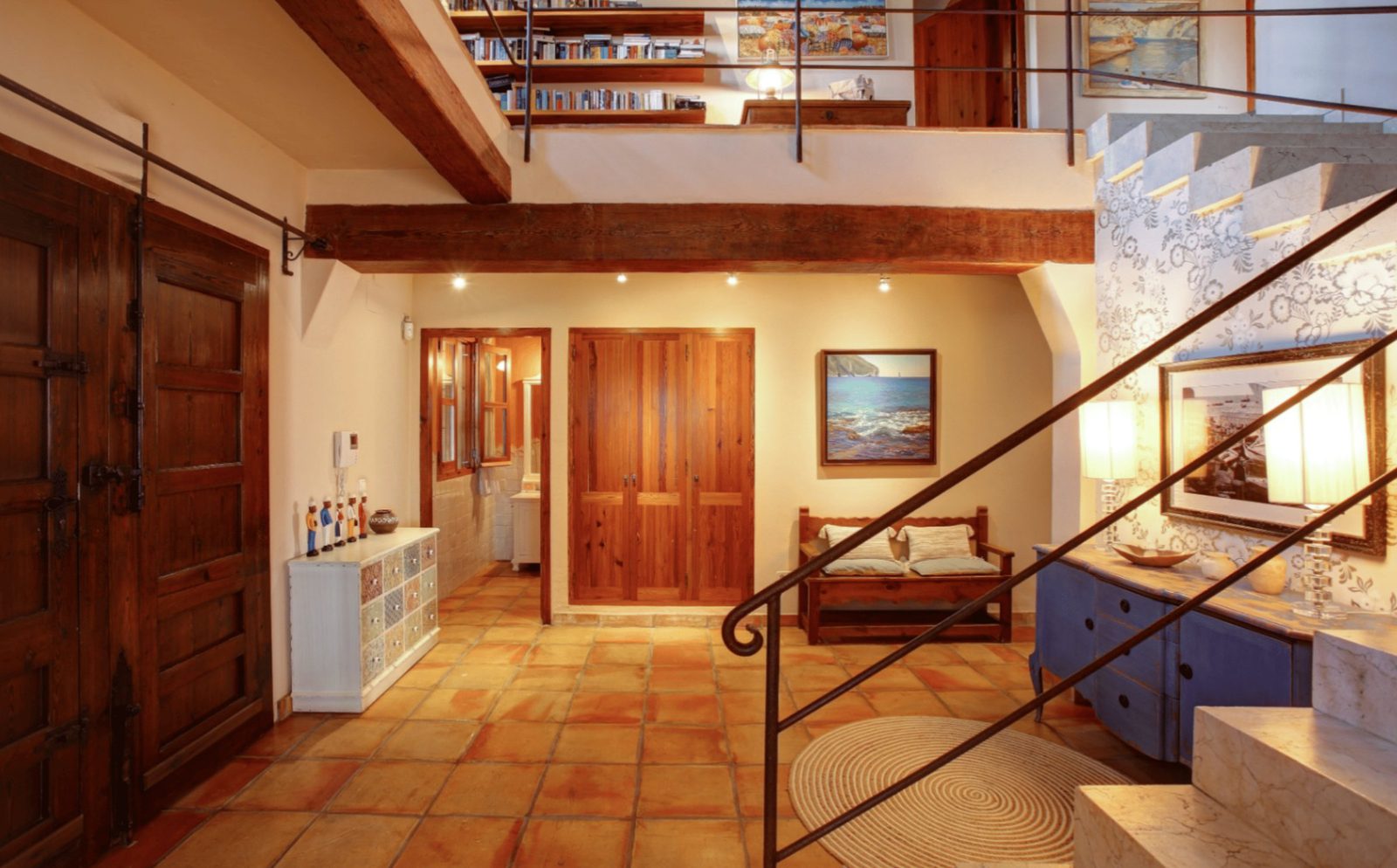 Stylish interior hallway with wooden features and staircase in a 4-bedroom finca in Moraira - The Estates
