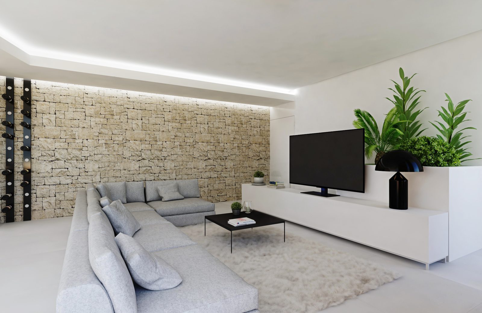 Contemporary living room with sectional sofa, stone accent wall and TV of a 3-bedroom apartment in Calpe - The Estates