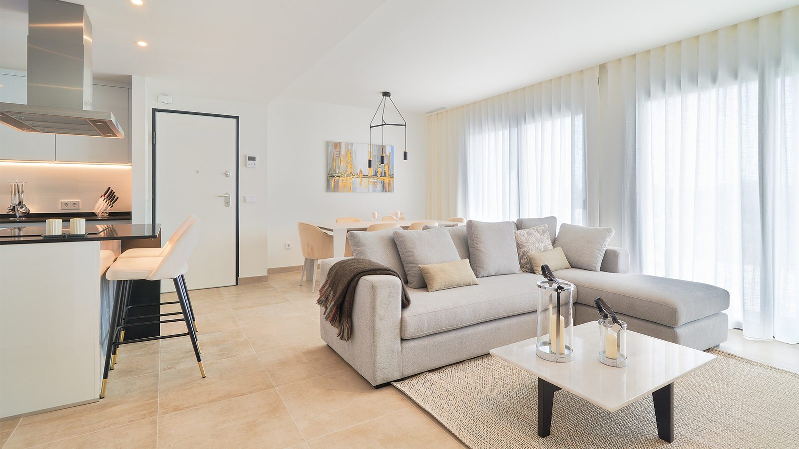 Stylish living room and kitchen area of a 3-bedroom apartment in Estepona - The Estates