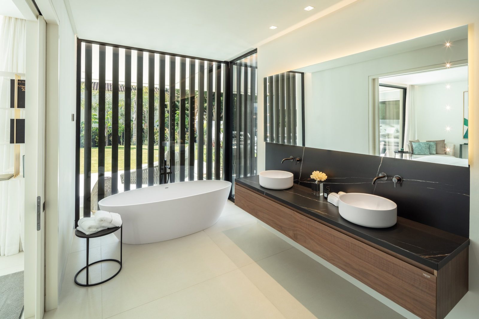 Contemporary bathroom with a freestanding tub, double vanity and garden views in a 5-bedroom villa in Málaga - The Estates