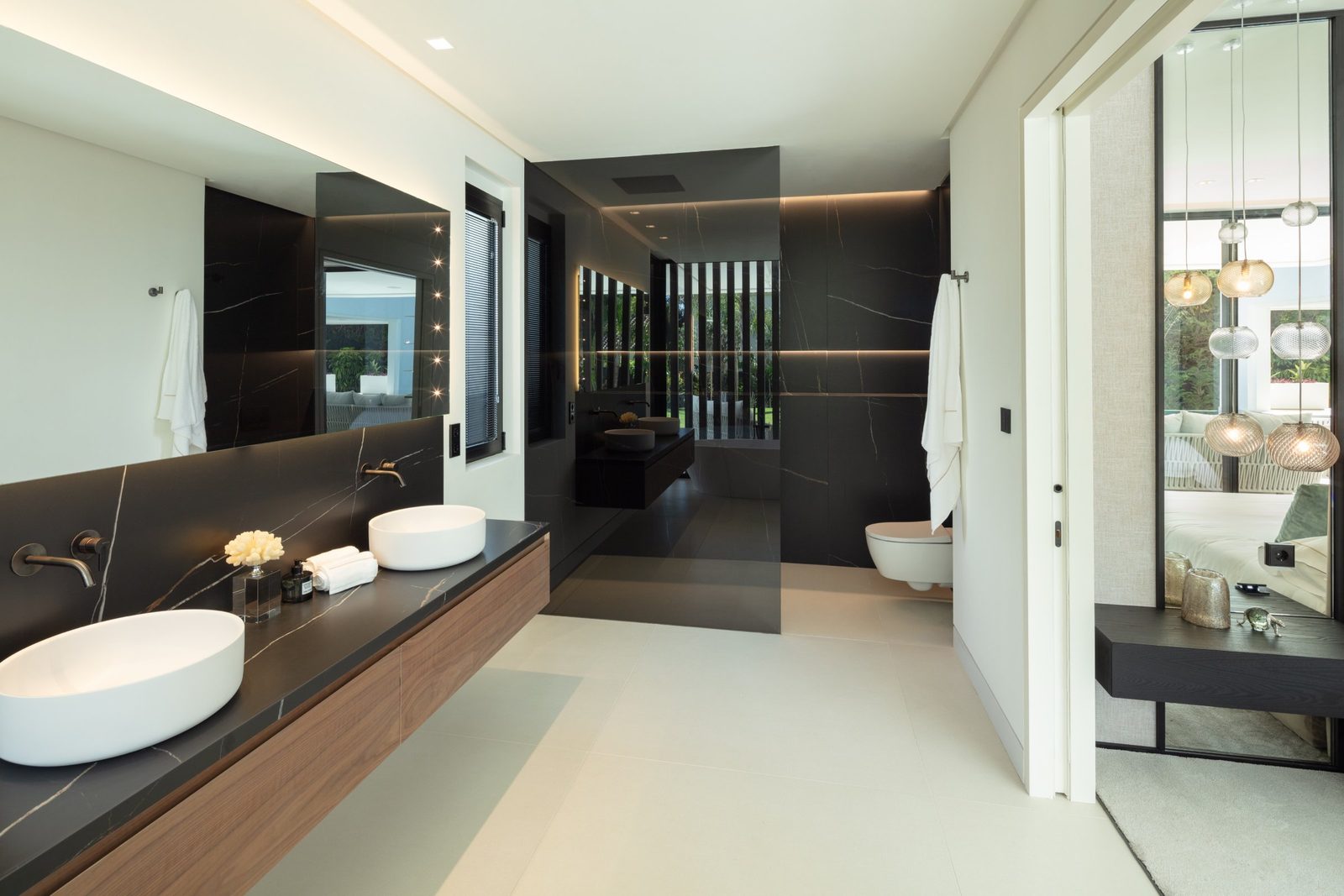 Contemporary marble bathroom with double vessel sinks and freestanding bathtub of a 5-bedroom villa in Málaga - The Estates