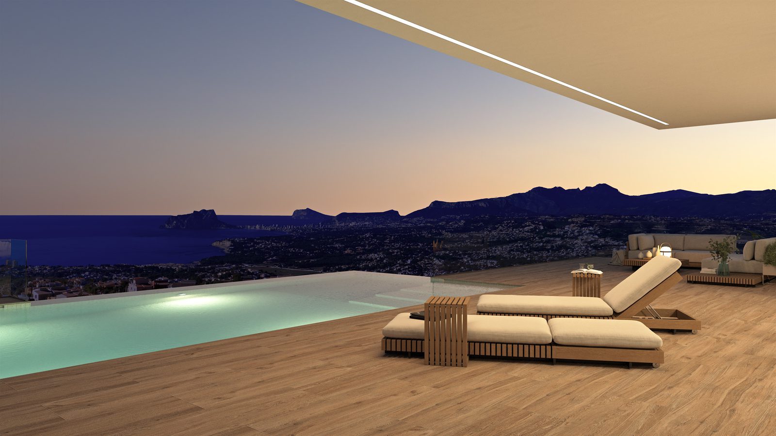 Infinity pool terrace with loungers and panoramic sea and mountain views of a 3-bedroom villa in Benitachell - The Estates