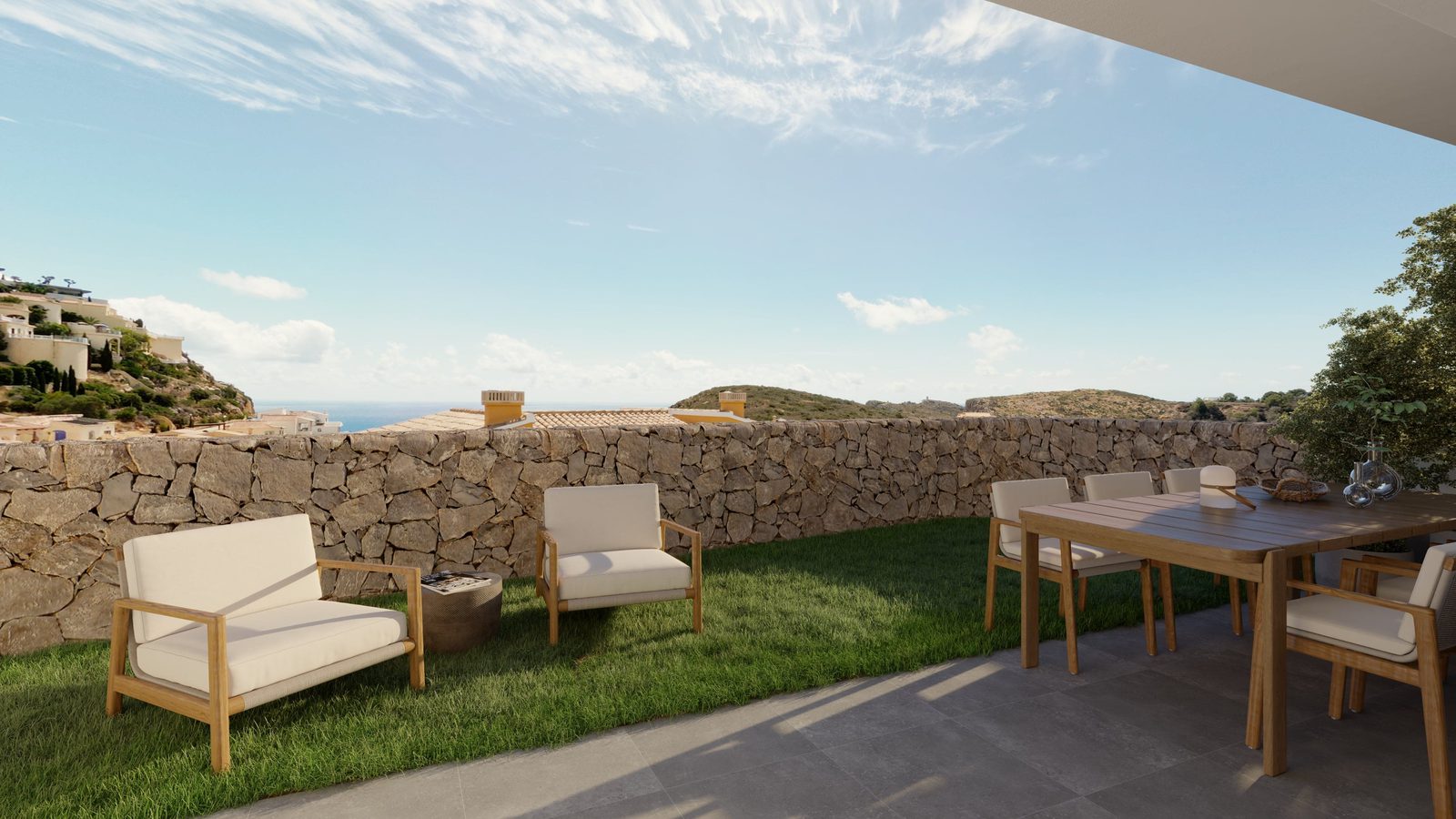 Outdoor dining area with lounge seating and scenic views of a 3-bedroom apartment in Benitachell - The Estates