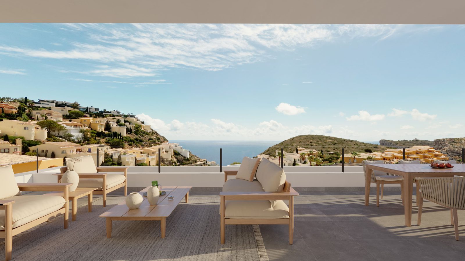 Outdoor terrace with seating overlooking the coastal views of a 3-bedroom apartment in Benitachell - The Estates