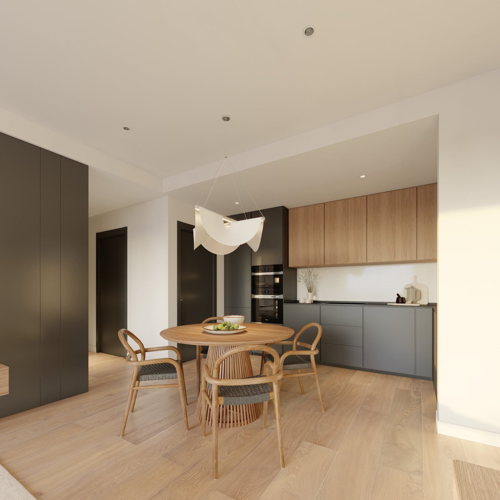 A modern kitchen and dining area in a 3-bedroom apartment in Benitachell - The Estates